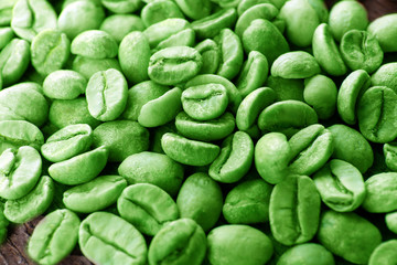 Heap of green coffee close up
