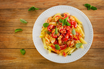penne with meat, sauce and vegetables.