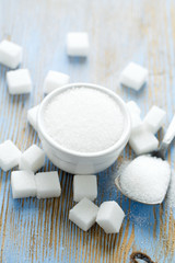 white sugar cubes on wooden surface