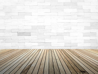 perspective wood plank floor with over blur Brick wall backgroun