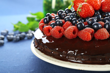 Delicious chocolate cake with summer berries, closeup