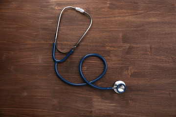 Stethoscope on wooden background