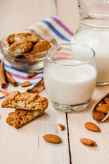 milk and cookies on wooden boards