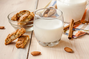 milk and cookies on wooden boards