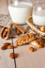 milk and cookies on wooden boards