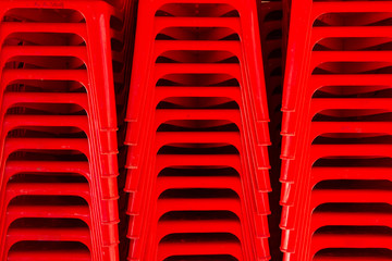 Red chairs are stackable