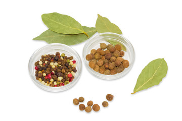 Dried bay leaf, glass containers with pepper and allspice