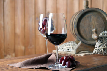 Beautiful still life with wine and grape on wooden table