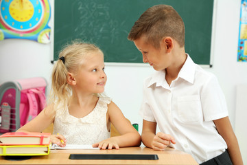 Portrait of happy pupils at lesson