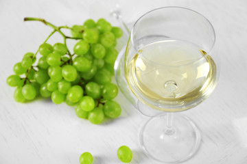 Still life of wine and bread on light background