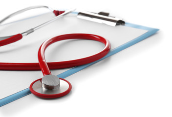 Medical stethoscope with clipboard isolated on white