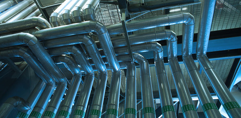 Fototapeta premium Industrial zone, Steel pipelines in green tones