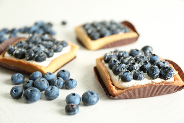 Gourmet fresh blueberry tarts on table