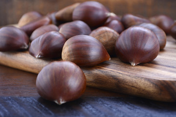 Chestnuts on Rustic Wood Table