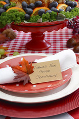 Thanksgiving Table Setting with Roast Turkey on Red White Backgr