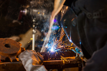 Welder in action. Low depth of focus