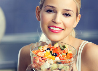 woman with vegetarian salad at home