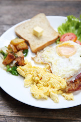 Breakfast with bacon , fried egg and bread