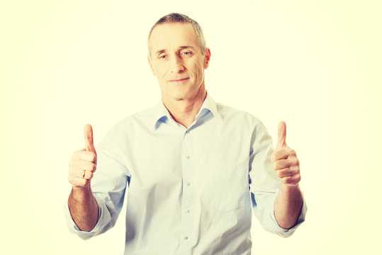 Mature man gesturing ok sign