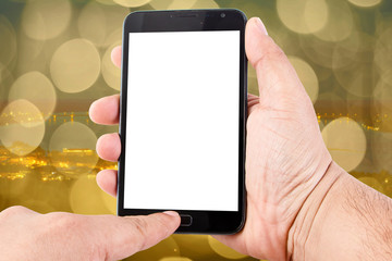 Man hand hold blank touch screen smart phone on abstract blurred