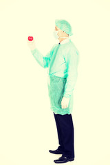 Male doctor holding heart model