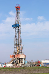 land oil drilling rig with equipment on oilfield