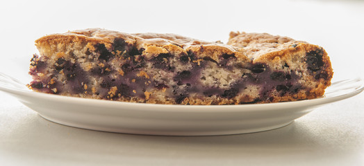 Blueberry pastry close up on white