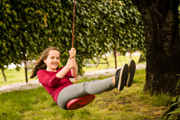 Girl swinging on seesaw