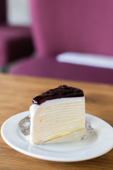 Blueberry cheese cake on wooden table