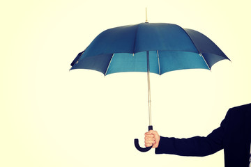 Close up on businessman hand with an umbrella