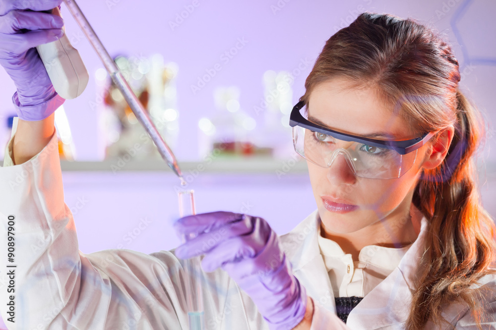 Poster young scientist pipetting in life science laboratory.