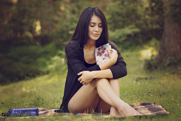 beautiful woman writer is inspired by nature