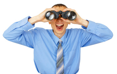 Shocked business man with blue tie with binoculars