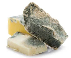 Heap of inedible mouldy cheese isolated on white background
