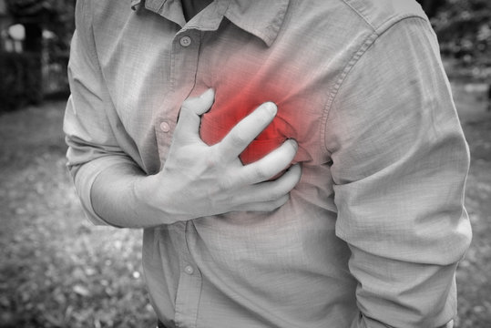 Man having chest pain - heart attack, outdoors