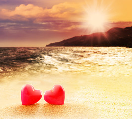Hearts on summer sunset beach