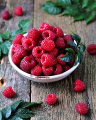 organic raspberries on a wooden background