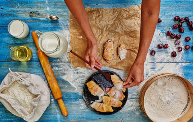 Fototapeta premium Cook woman puts bagels ready