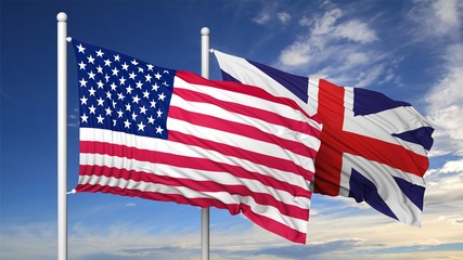 Waving flags of USA and UK on flagpole, on blue sky background.