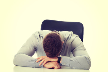 Fototapeta premium Businessman sitting by a desk in the office.
