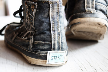 label with the word start on sneakers.