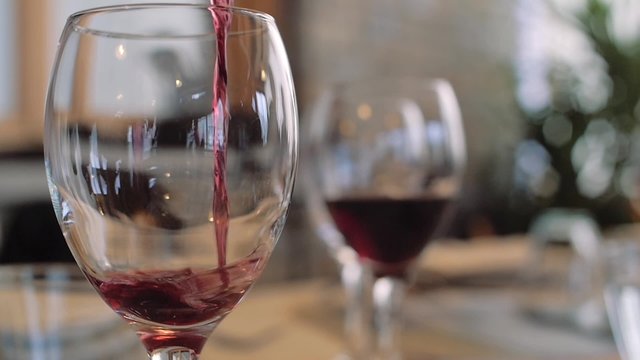 pouring red wine