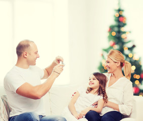 happy family with camera at home