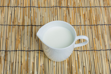 Cow milk and ceramic jug