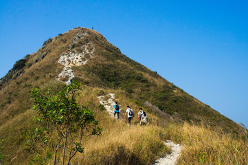 People walking to a sharp peak