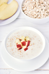 Porridge with red apple slices