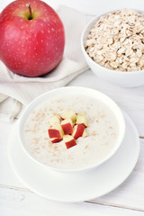 Oat porridge with red apple slices