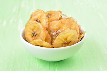 Banana chips in white bowl