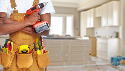 Builder handyman with construction tools. - 90919557