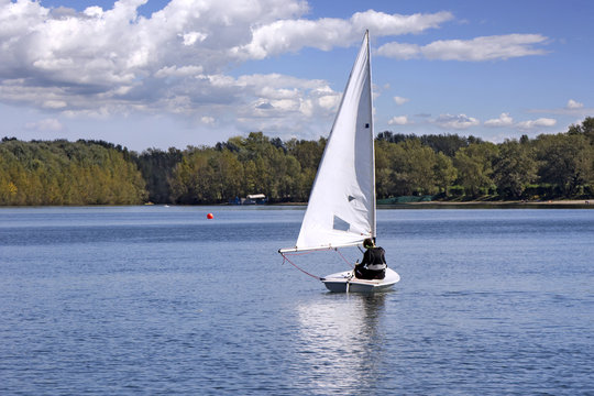 Small white boat Sailing on the lake